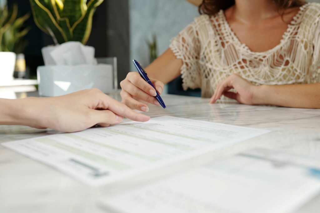 Signing Document at Travel Agency
